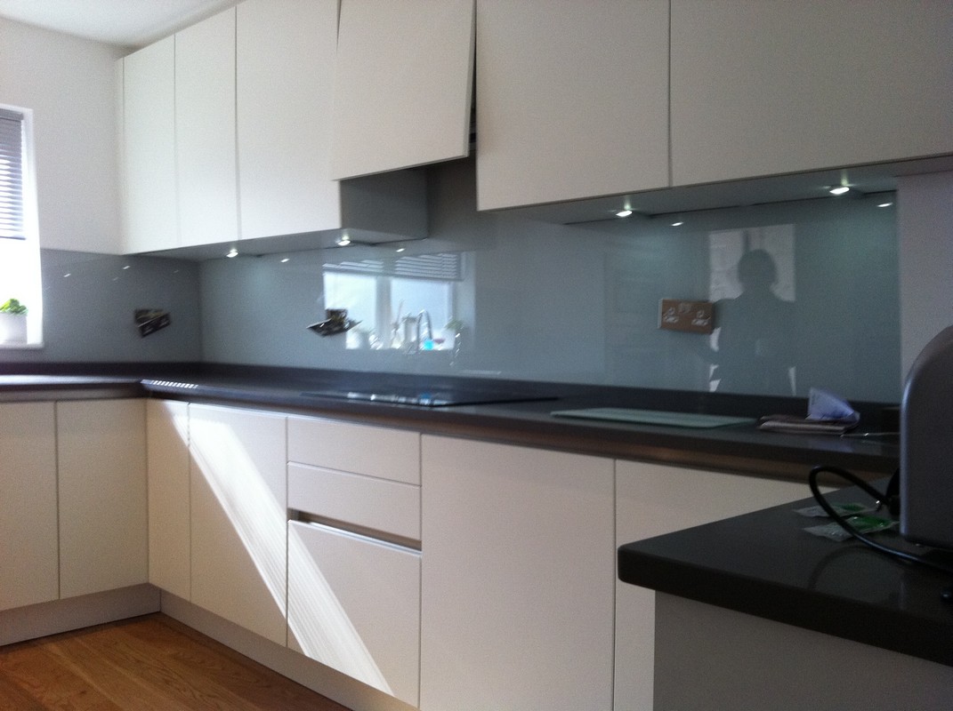 Grey glass kitchen splashback with LED lighting in Tufnell Park
