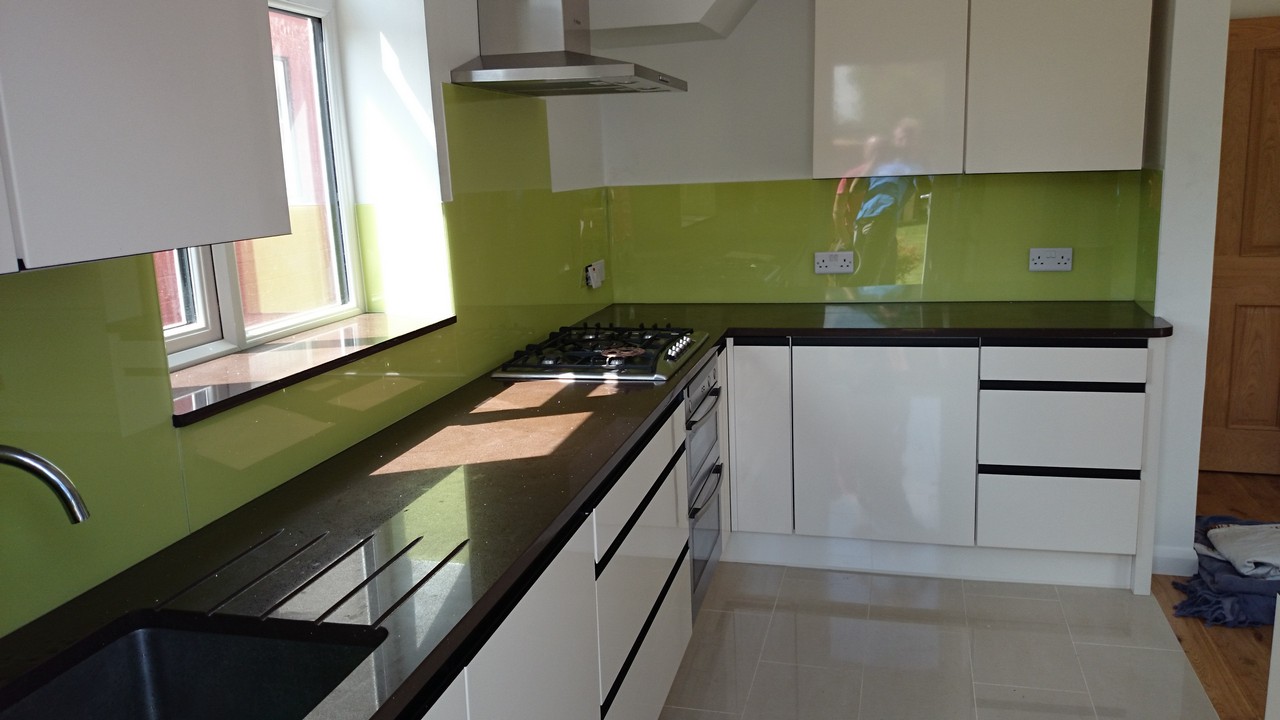 Lime green glass kitchen splashback installed by Tufnell Park glaziers