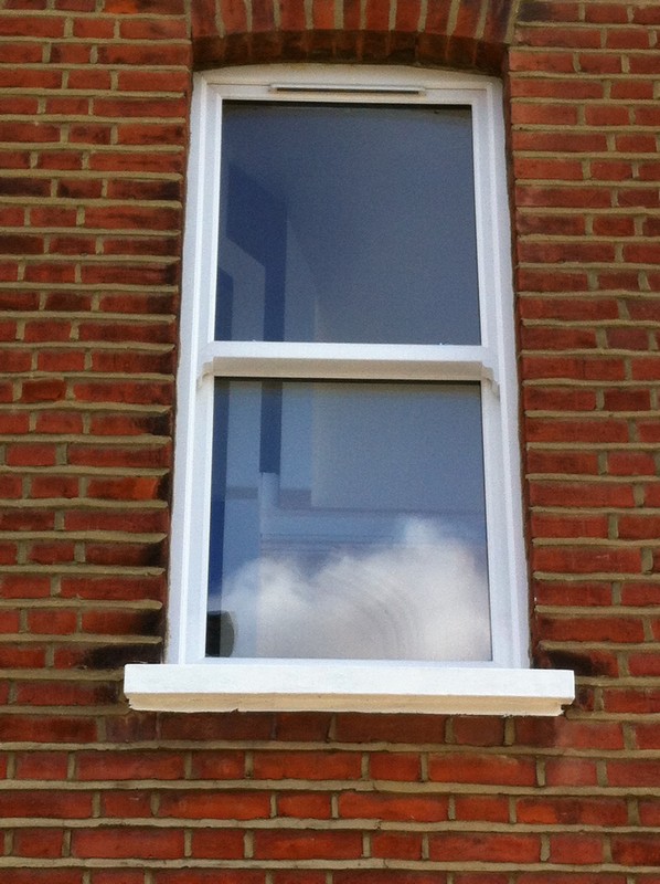 uPVC sash window on Victorian red brick house in Tufnell Park